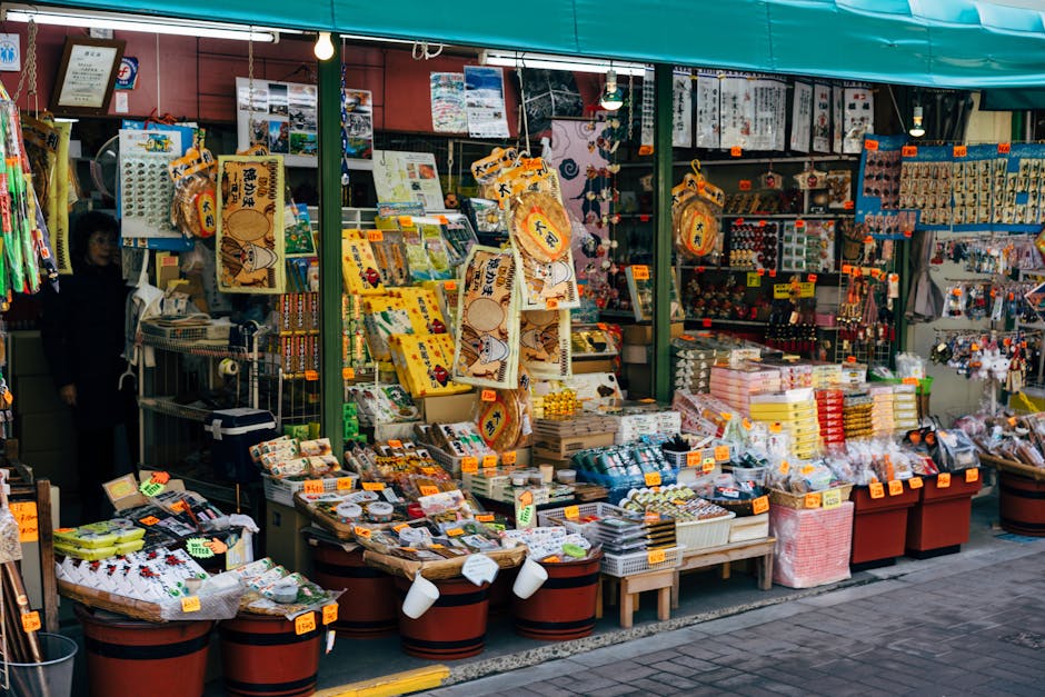 Vibrant outdoor storefront in Hachioji, Tokyo showcasing traditional Japanese souvenirs and goods.