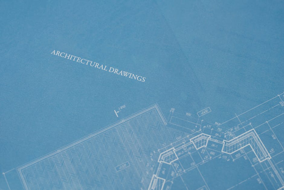 Close-up view of architectural blueprint with technical drawings.