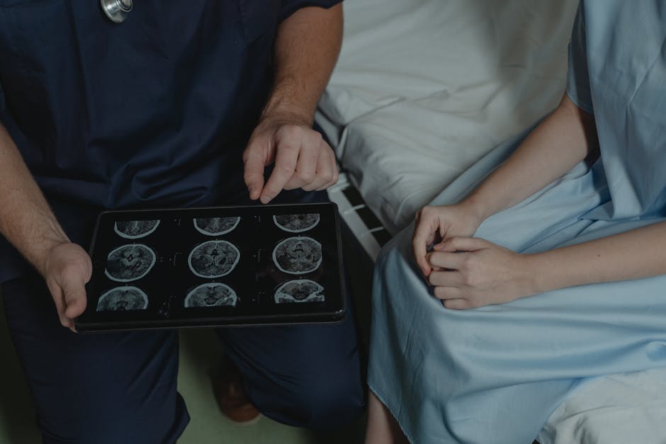 A doctor shows and explains brain scan images to a patient in a medical setting.